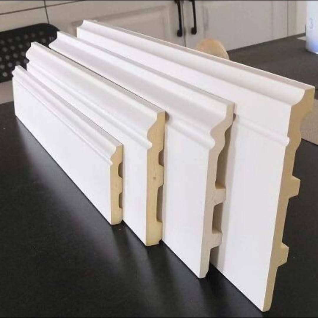 Skirting and nala profile trim fitted at a floor-to-wall junction