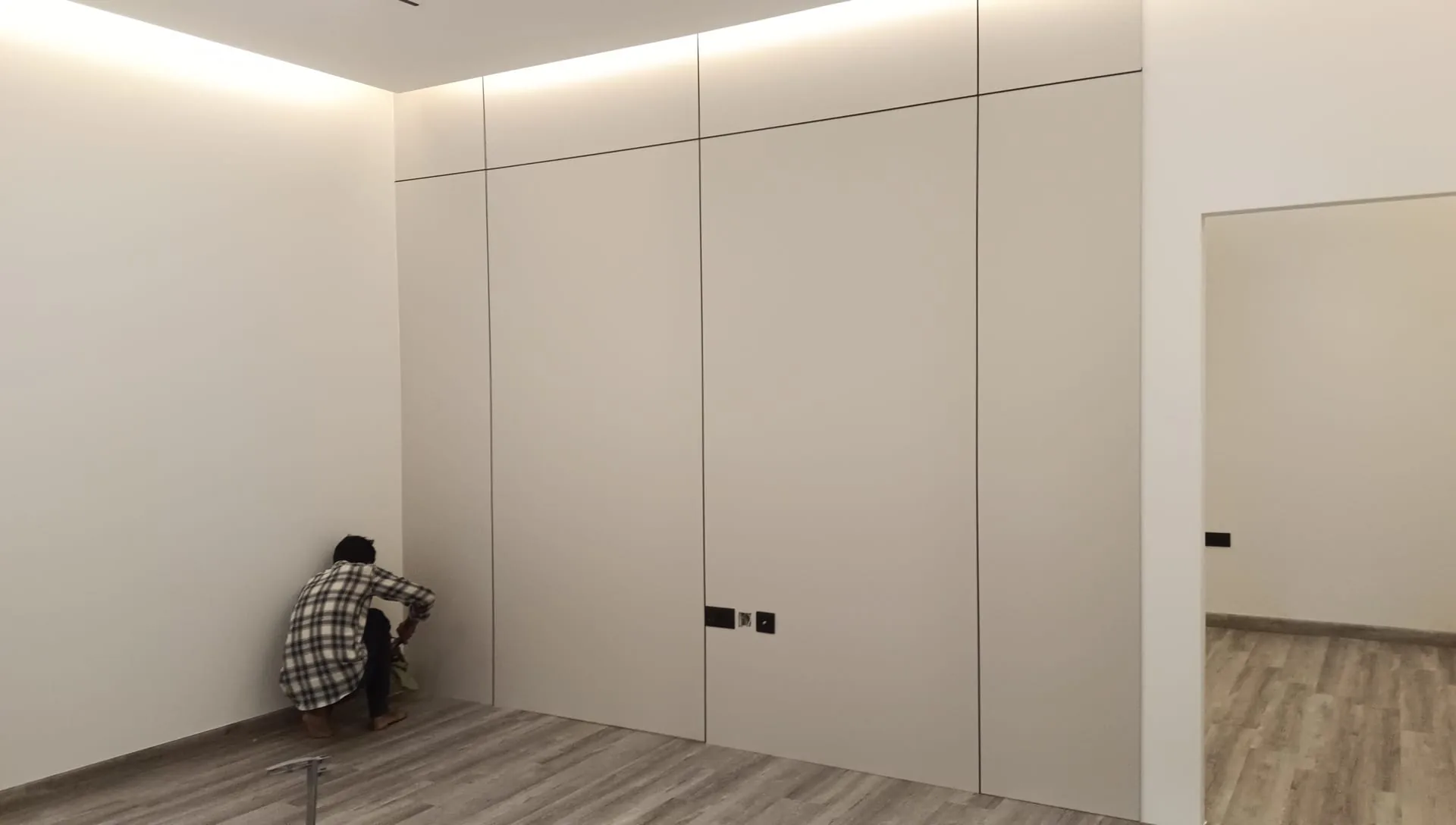 Fitted wardrobe being installed and scribed to the wall in a Doha bedroom